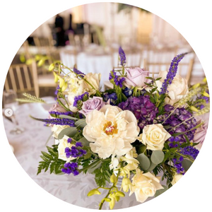 purple and white table centerpiece floral arrangement 